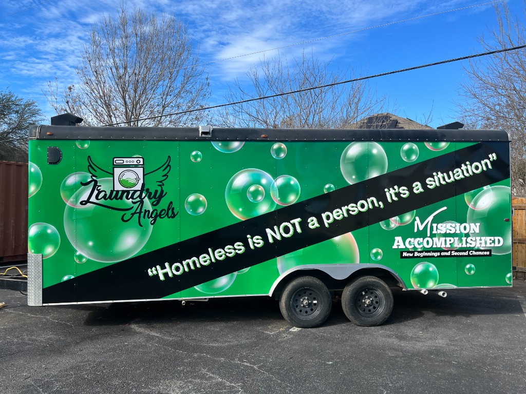 Mission Accomplished Laundry Angels trailer with the quote: 'Homeless is NOT a person, it's a situation'